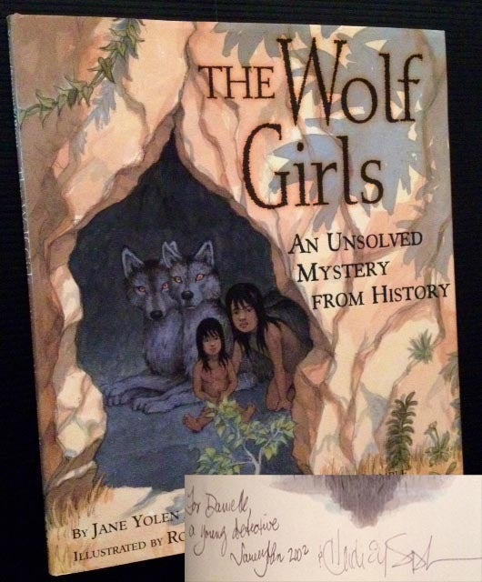 Item #12551 The Wolf Girls: An Unsolved Mystery from History. Jane Yolen, Heidi Elisabet Yolen Stemple.